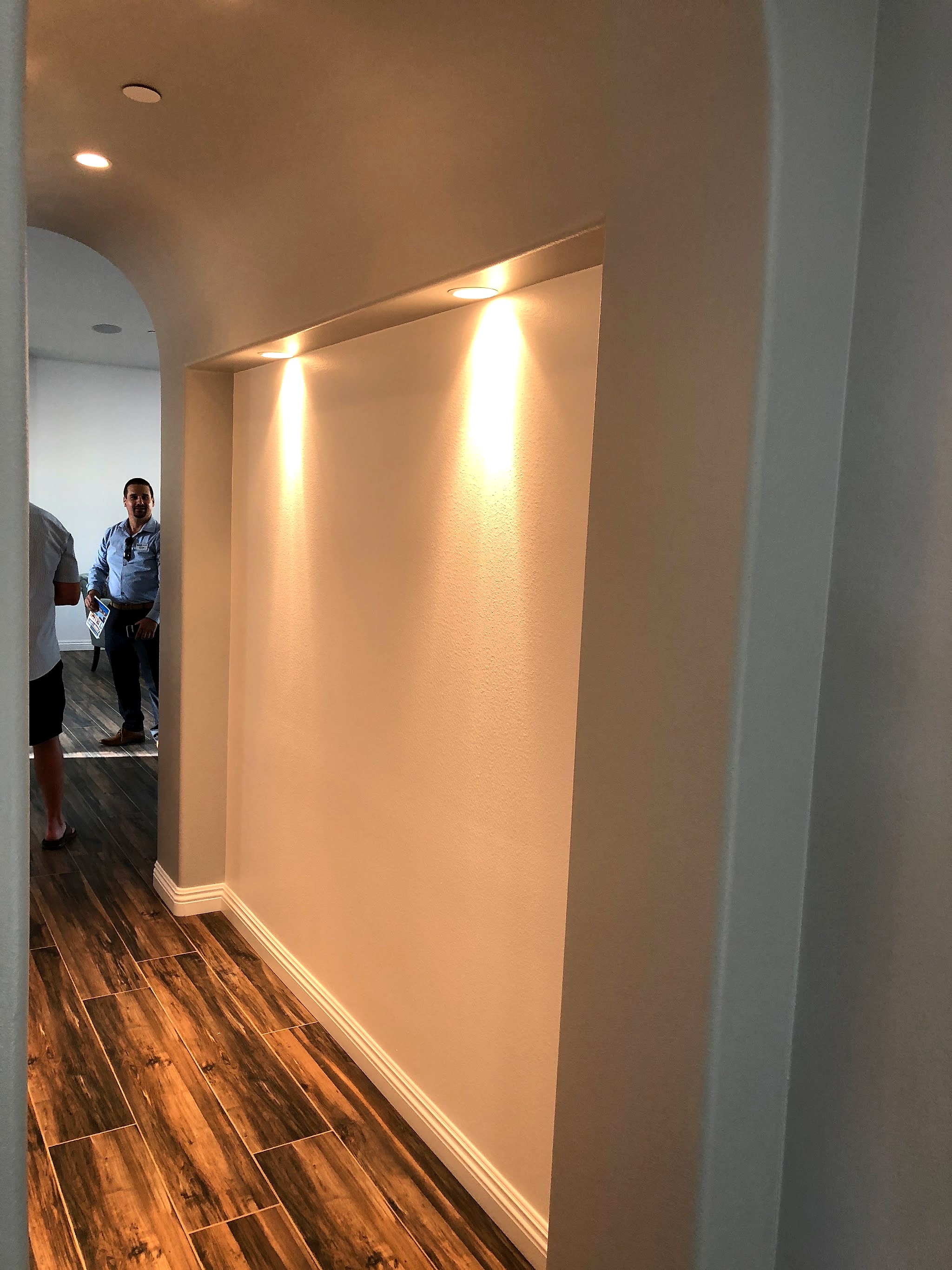 Hallway with recessed accent lighting in a wall niche