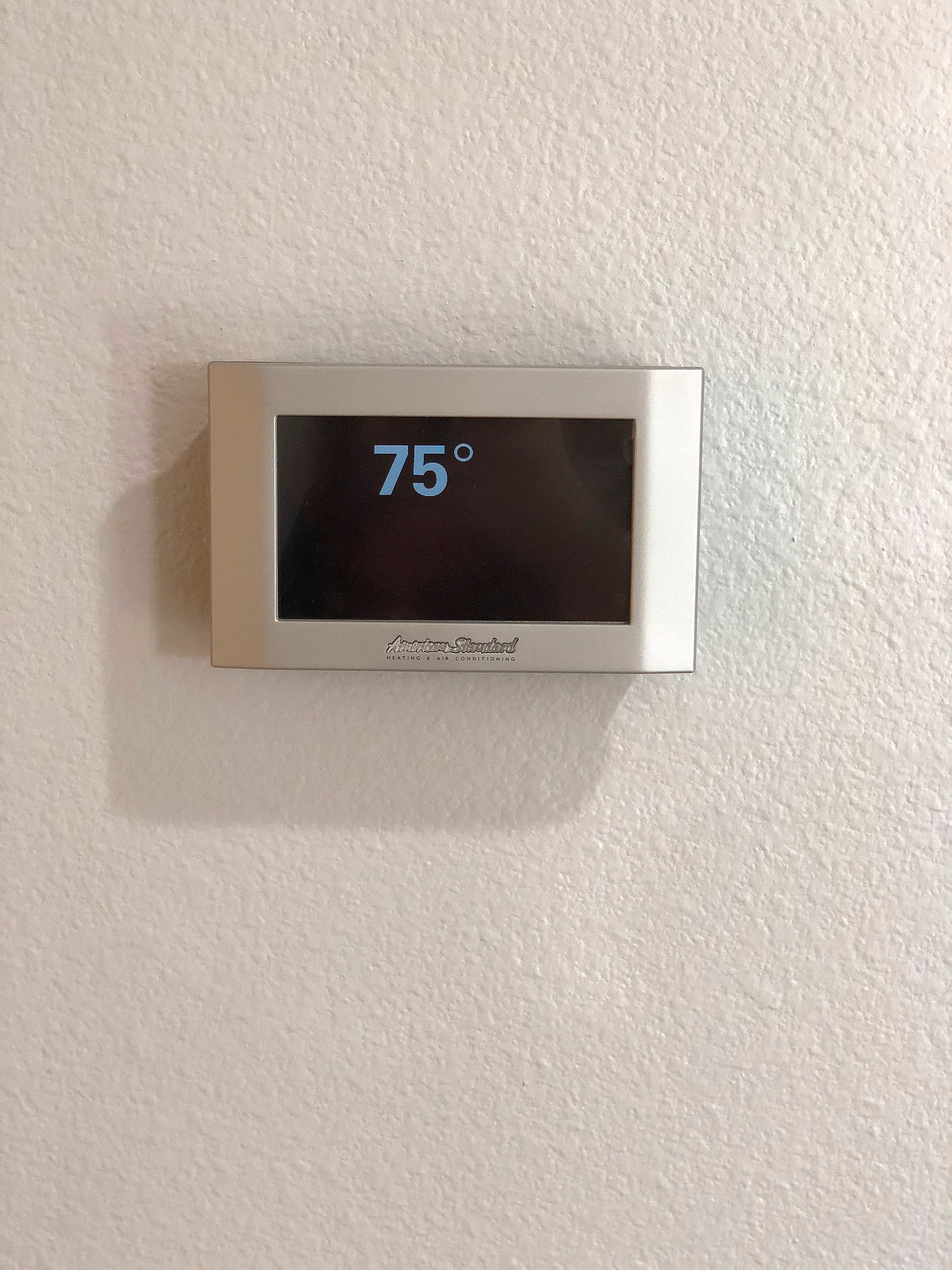 Wall thermostat reading 75 degrees